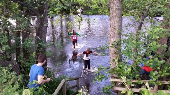 River section of the race - runniers in the river